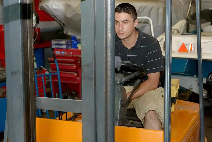 man driving forklift